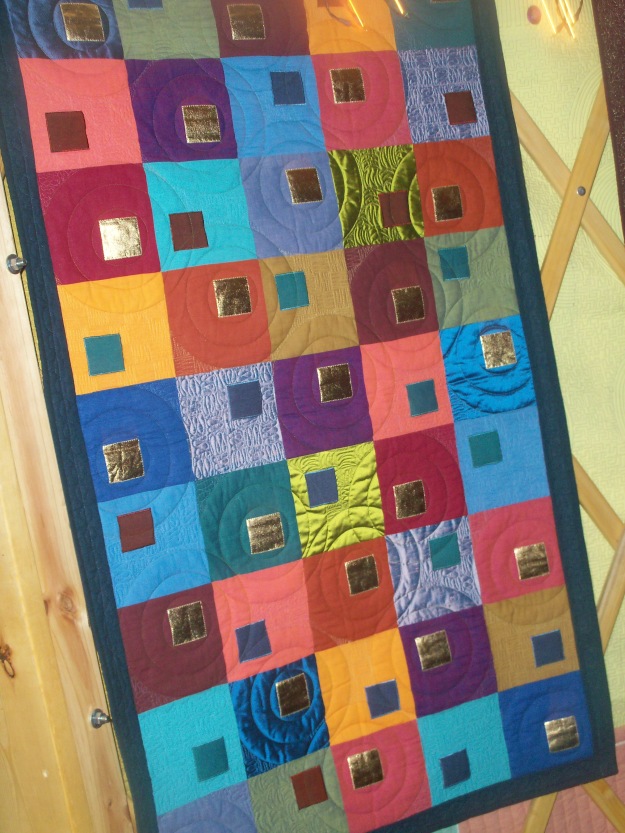 One of the quilts on the inside of the yurt